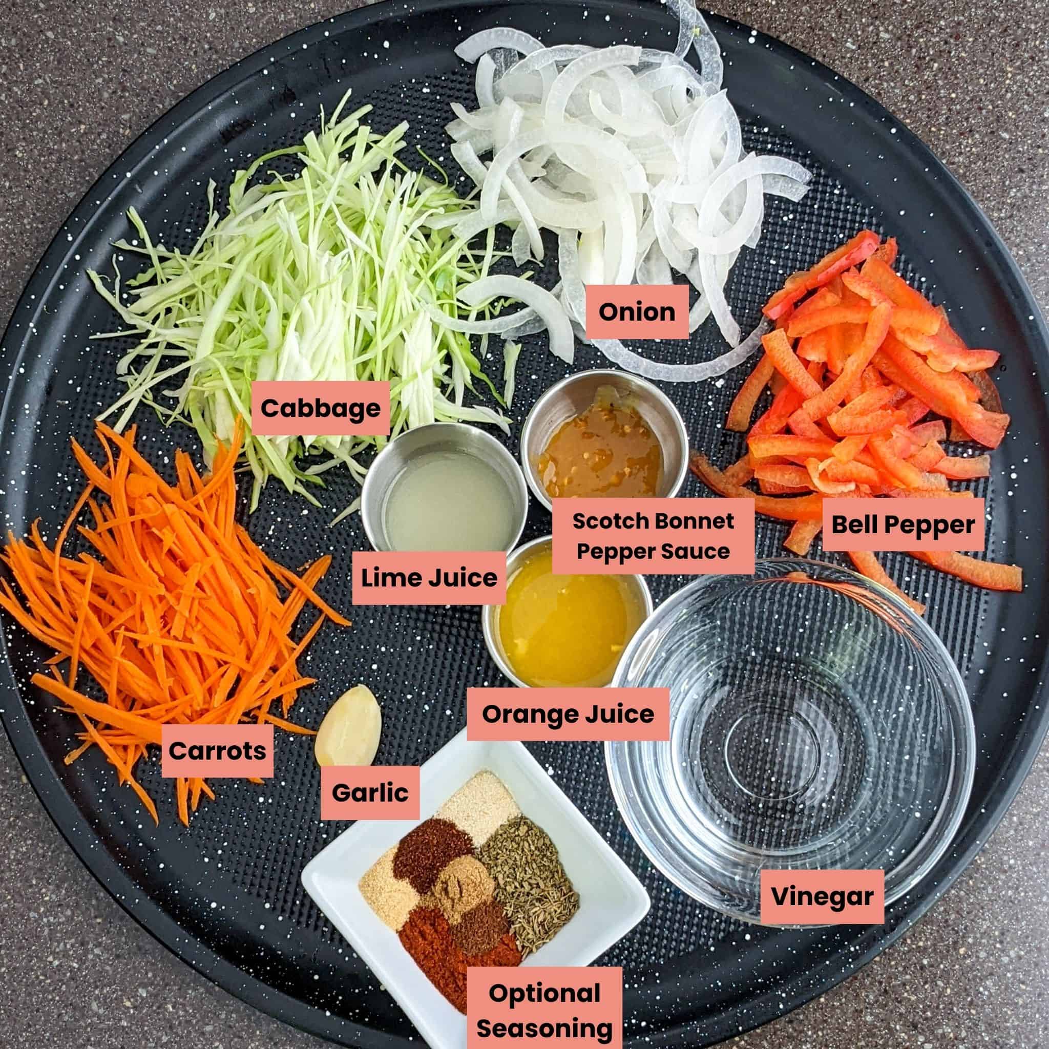 ingredients for haitian pikliz in dishes on a round tray.