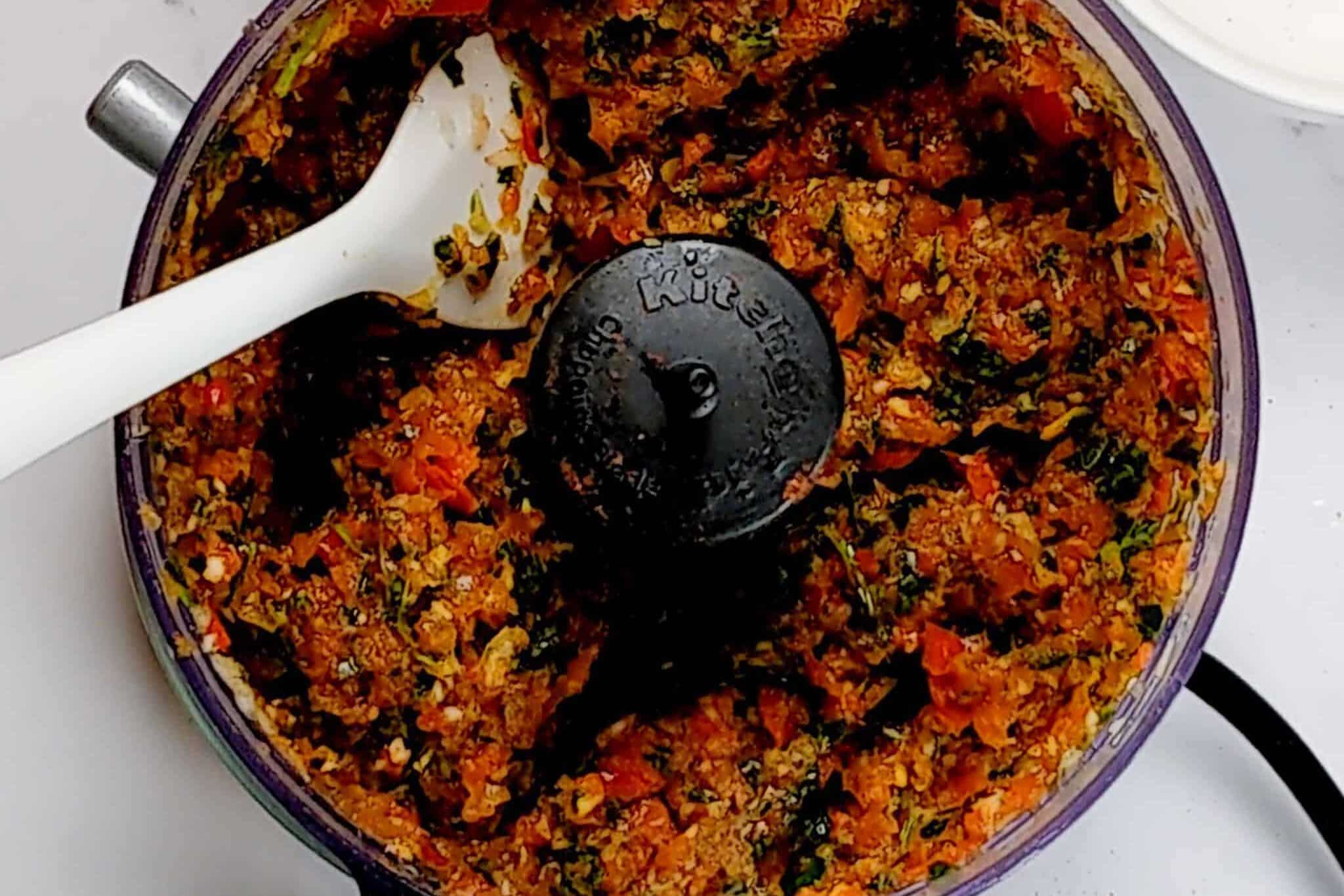 kitchenaid food processor with blended red bell pepper aromatic paste aka ata gige.
