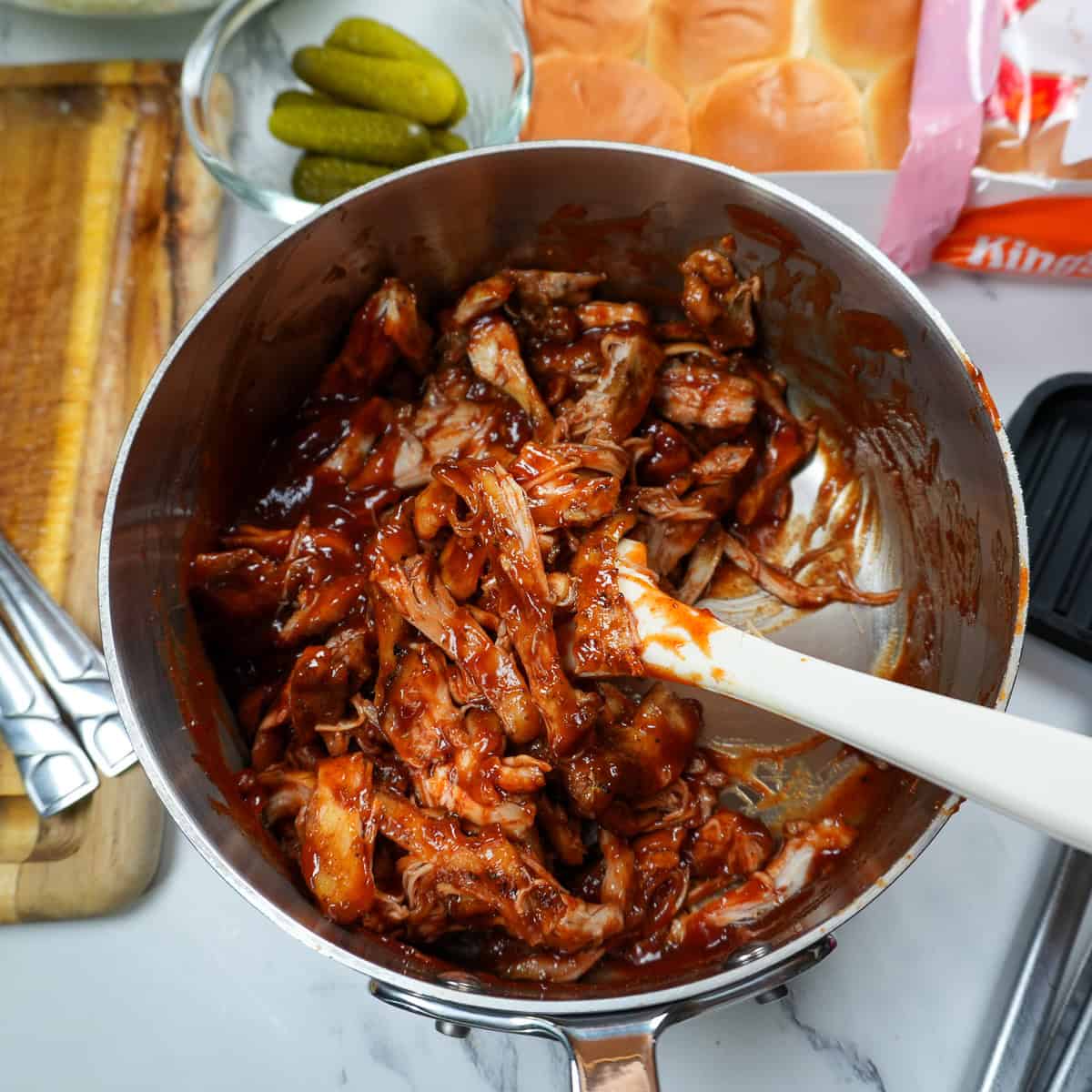 shredded chicken thighs folded into homemade bbq sauce.