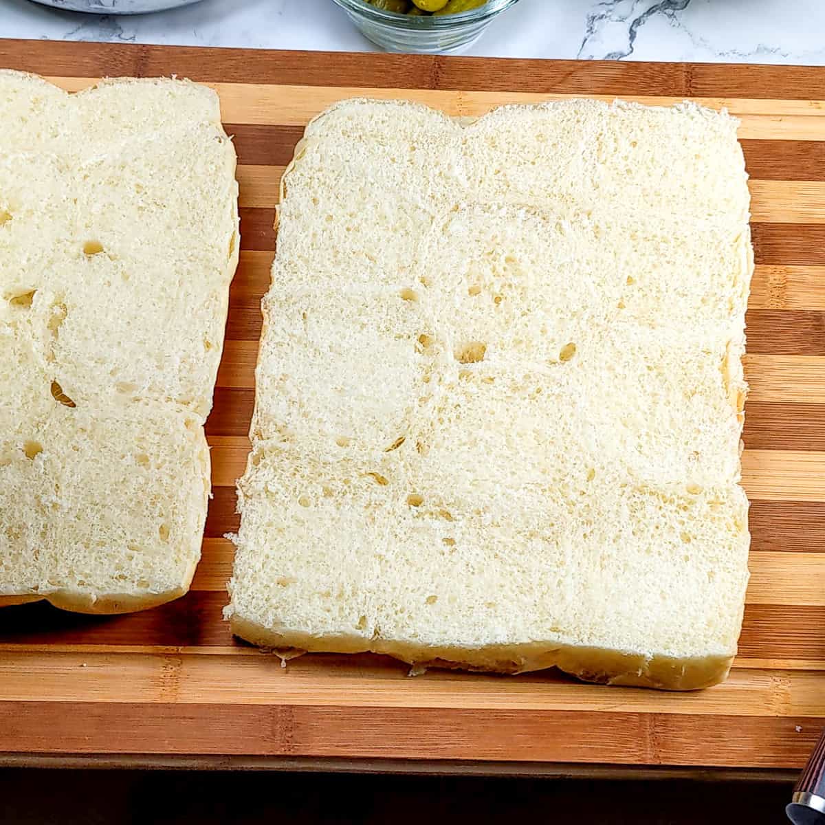open faced cut hawaiian sweet rolls.