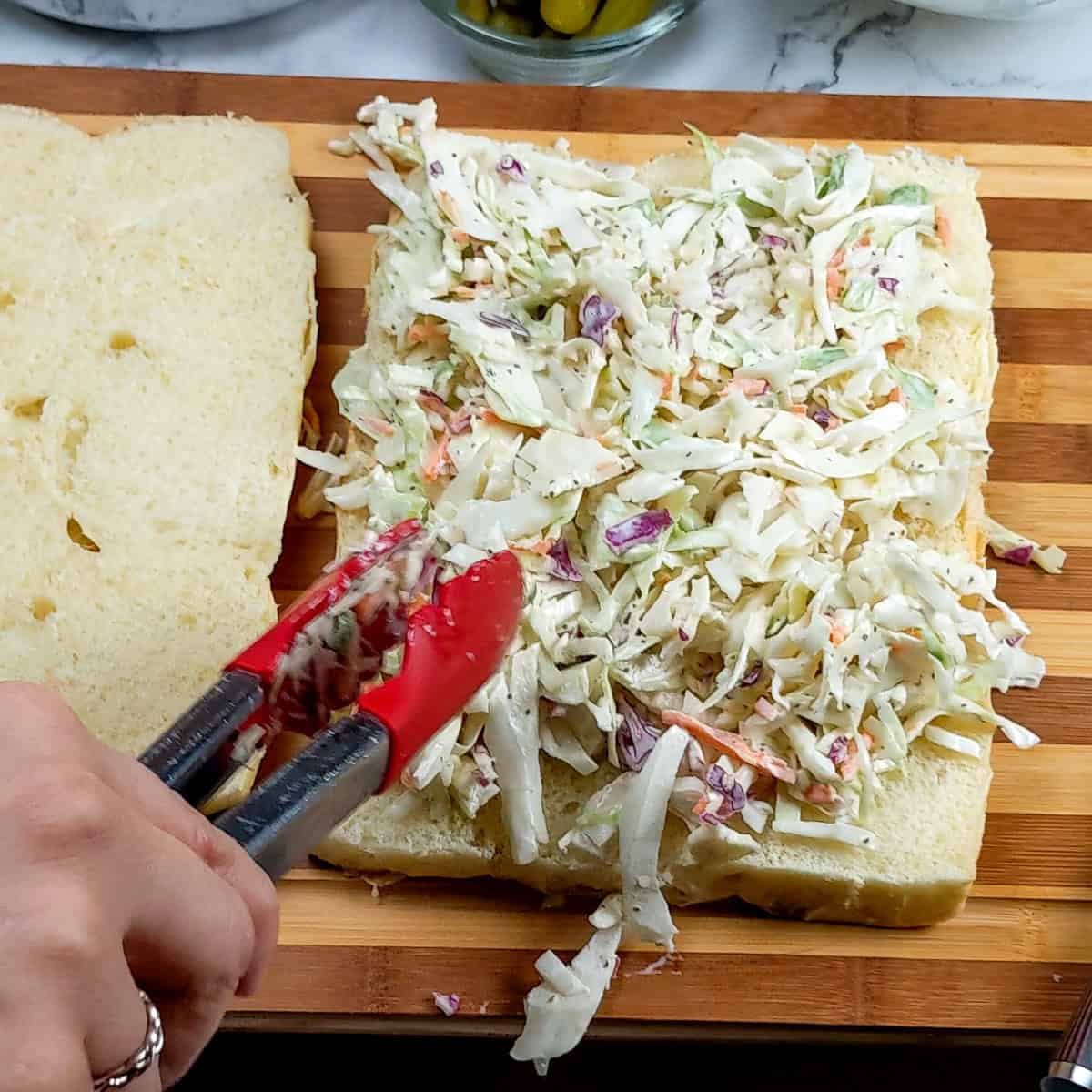 fresh homemade coleslaw layered on the hawaiian sweet rolls.