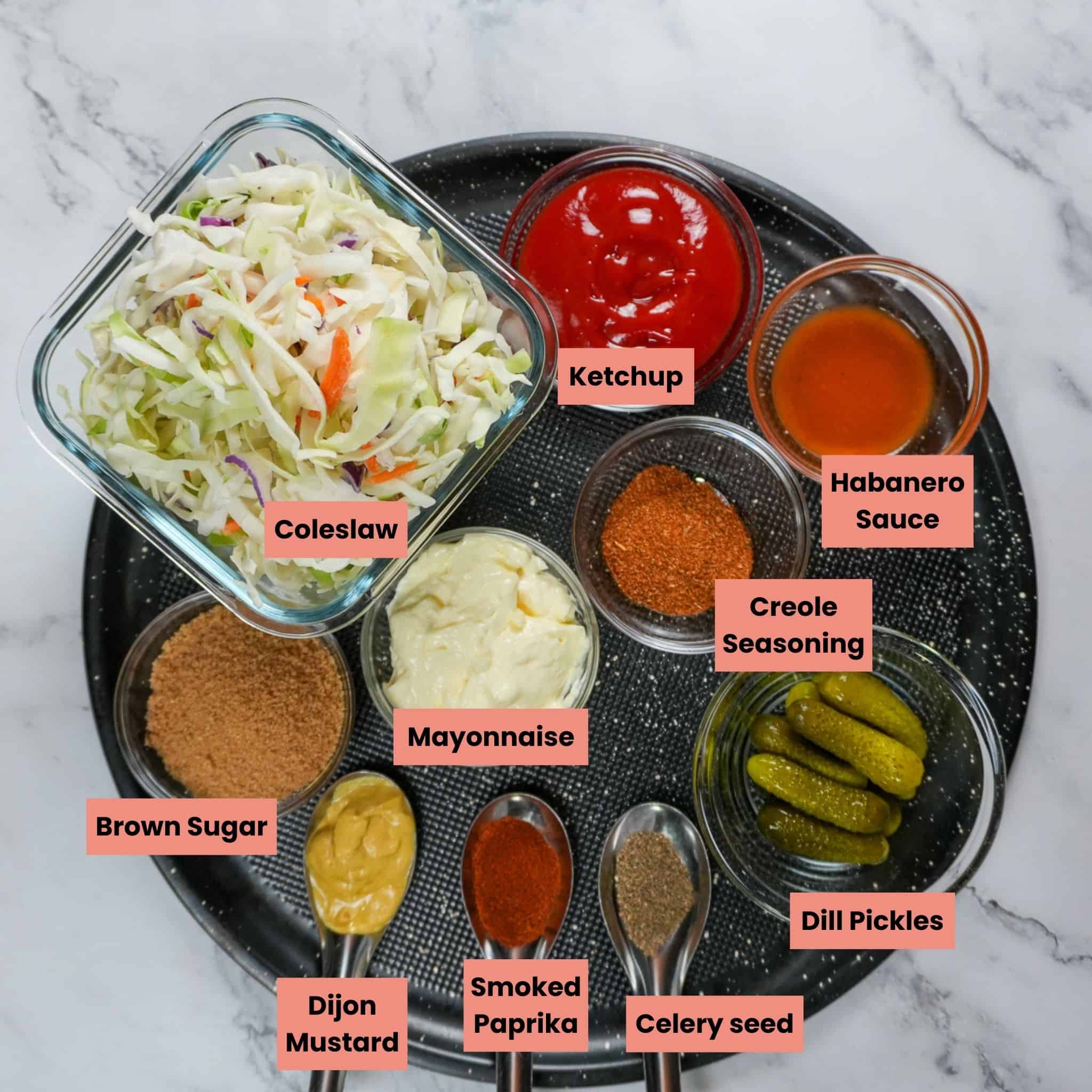 ingredients for the bbq chicken sliders on a round sheet tray.