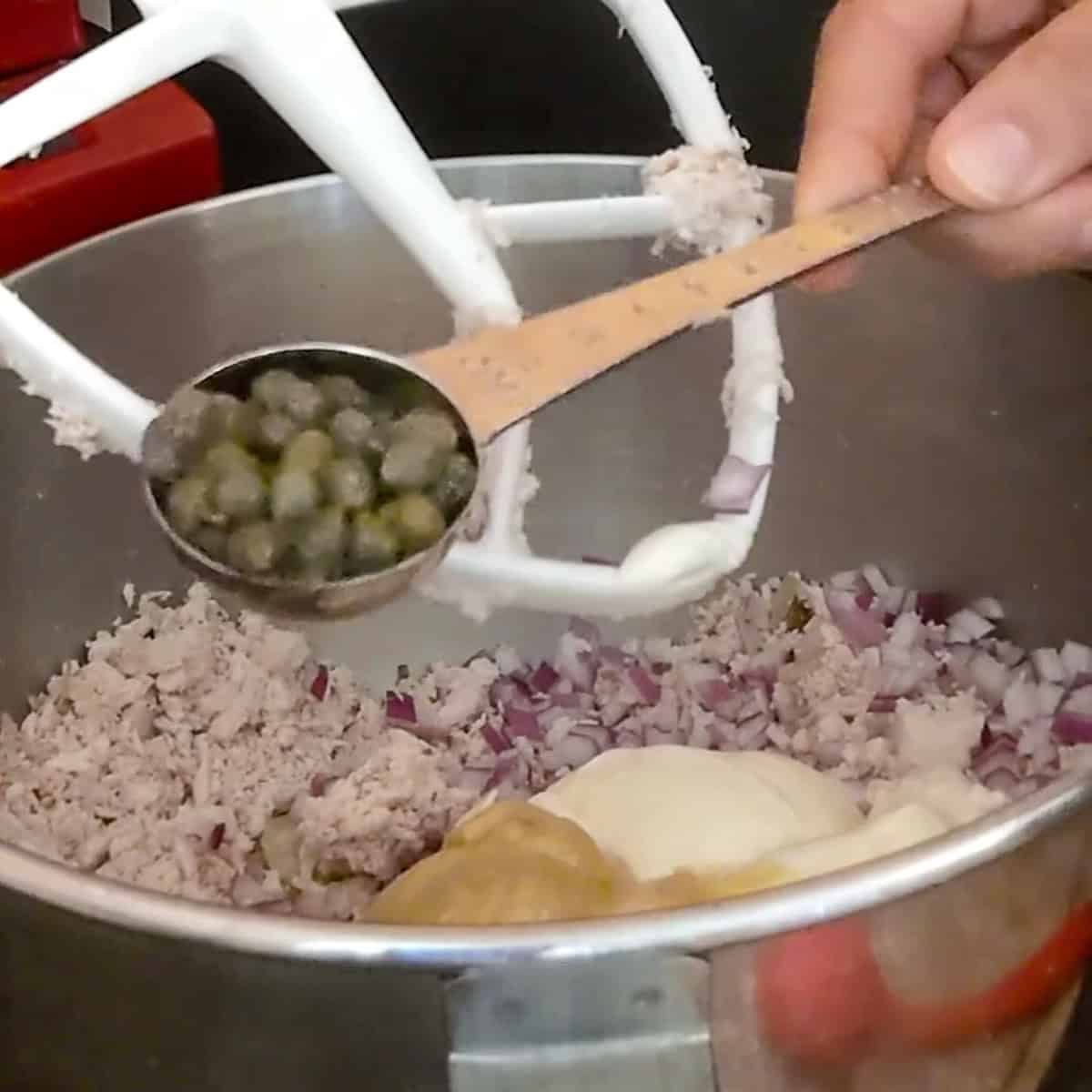 measuring spoonful of capers.