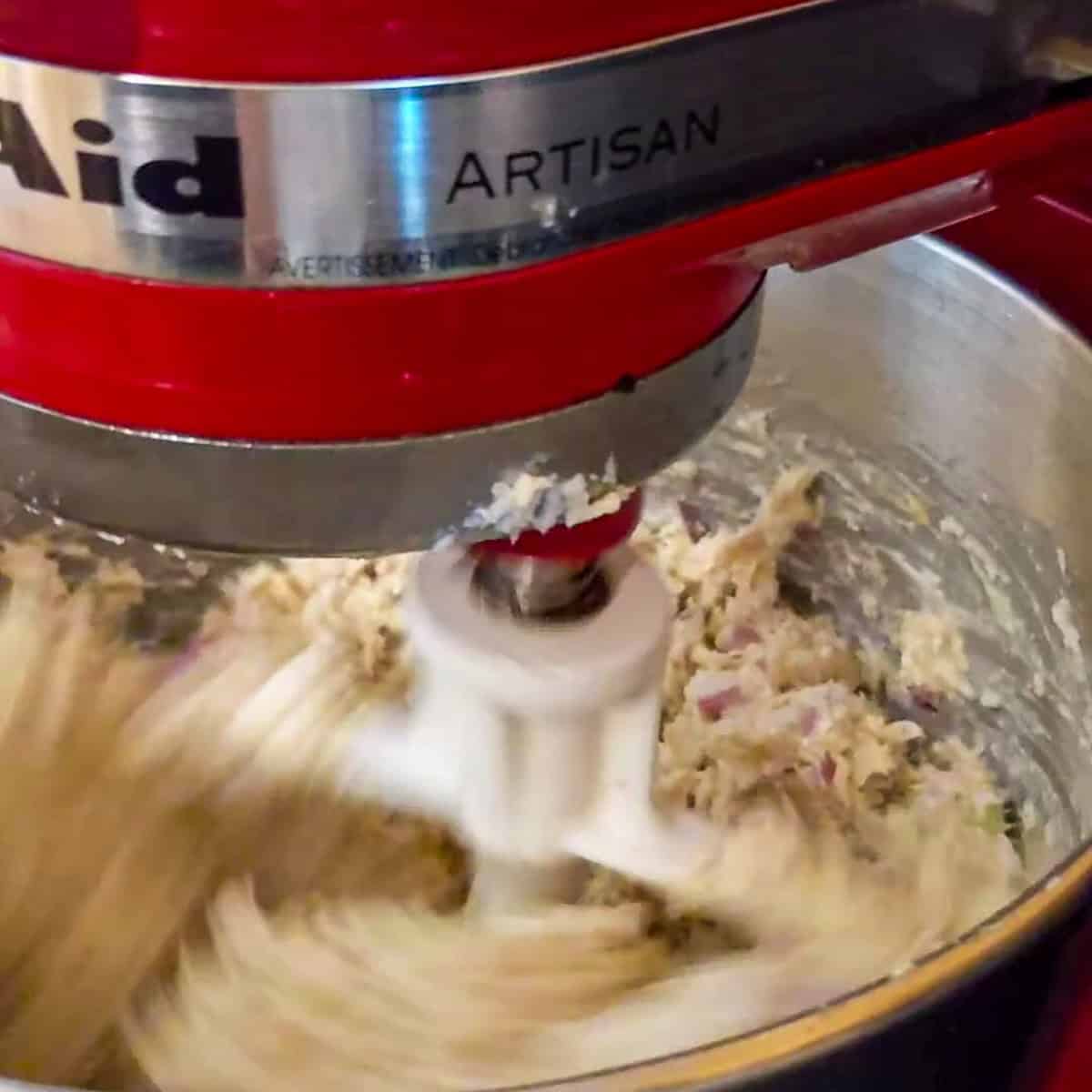 kitchenaid stand mixer with paddle attachment combining the chicken salad.