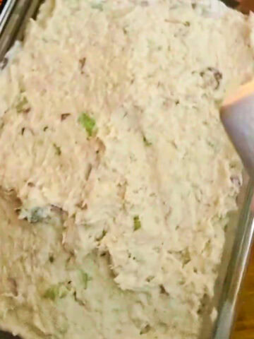 rectangle glass food storage container packed and evenly spread out freshly made chicken salad.