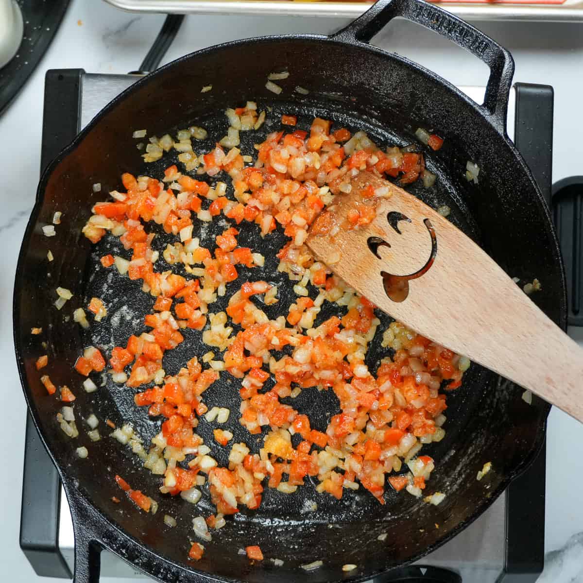 sauteed bell pepper, onions and garlic in a cast iron skillet.