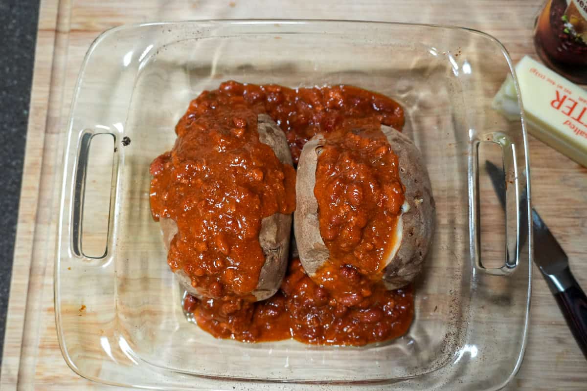 baked potatoes topped with turkey chili with beans.