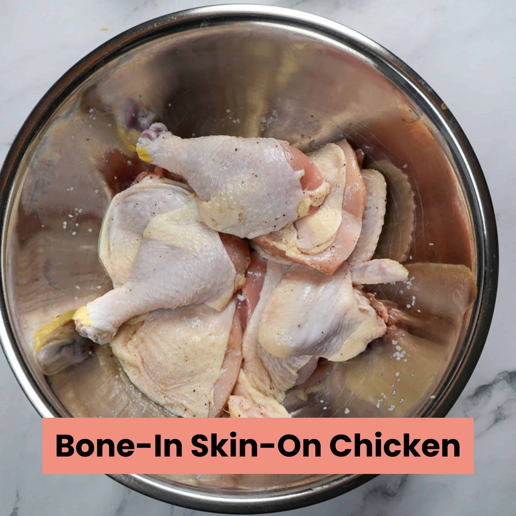bon in skin on chicken pieces in a mixing bowl.