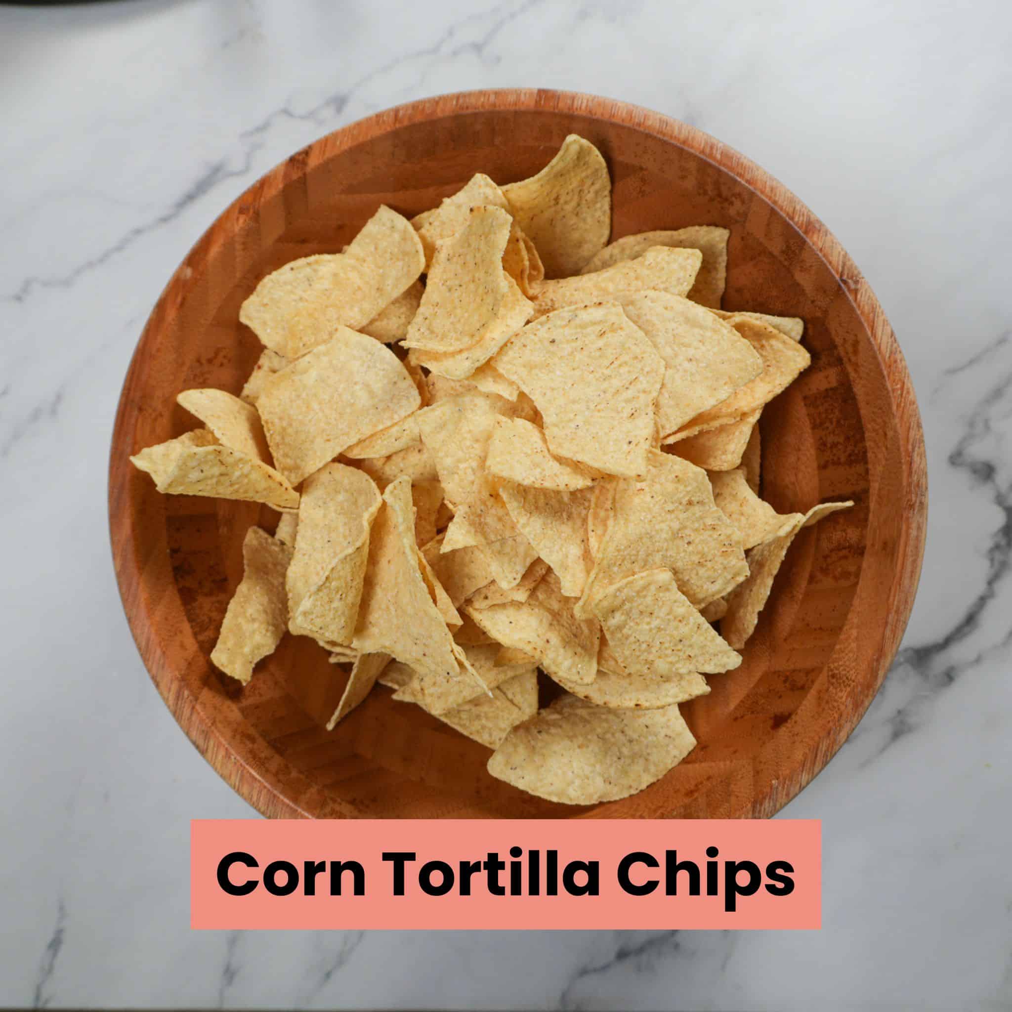 corn tortilla chips in a wooden bowl.