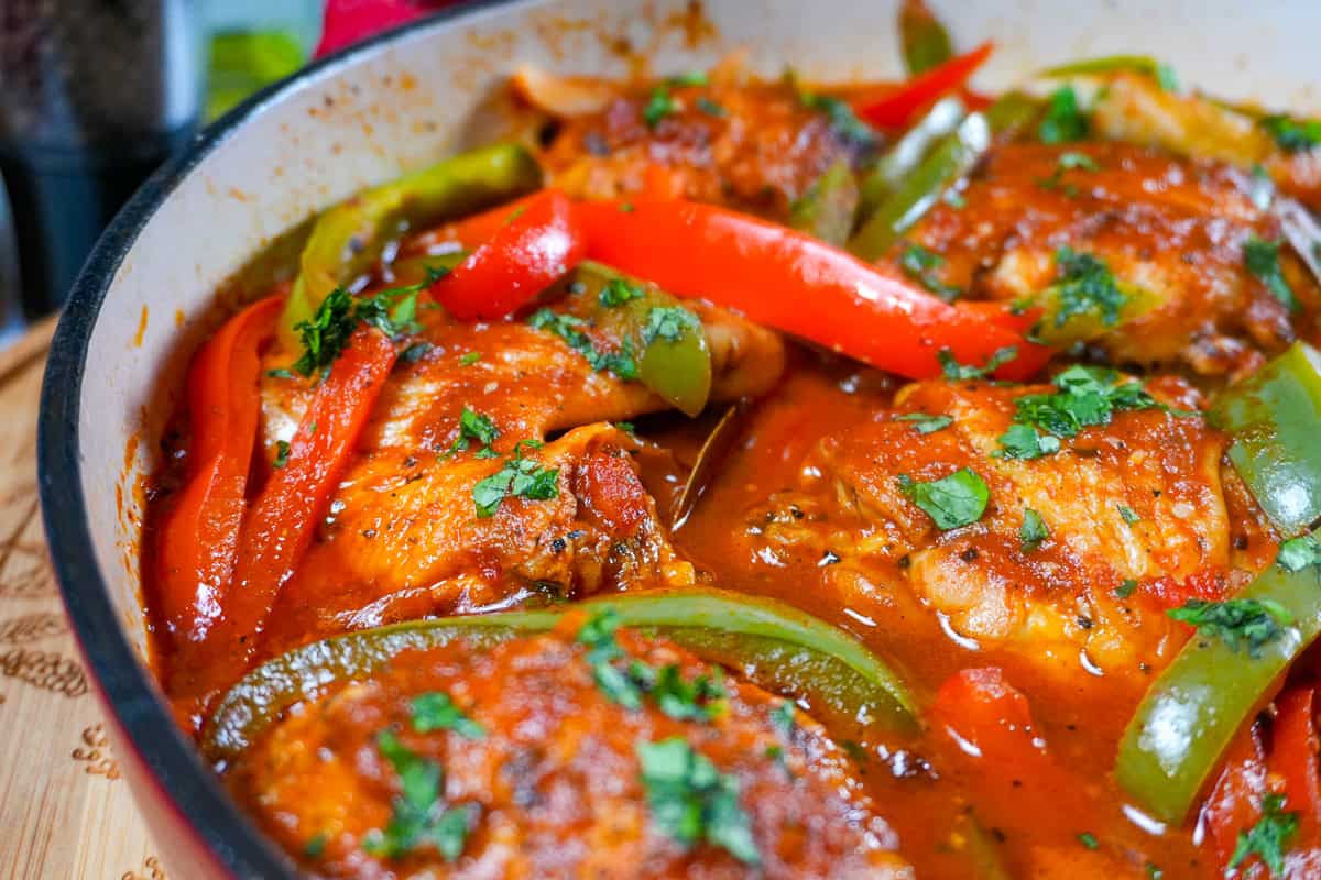 close up of the Mexican Braised Chicken dish in an lodge cast iron enameled dutch oven.