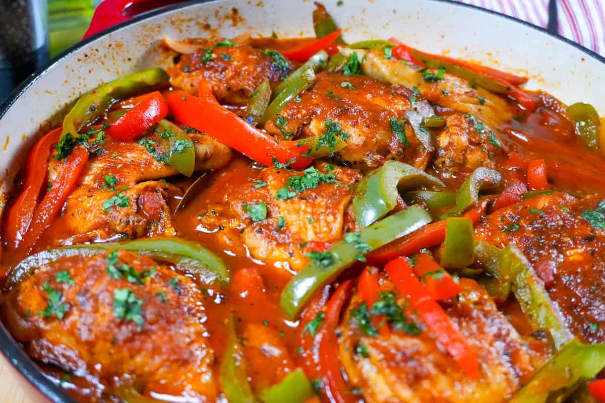 close up of the Mexican Braised Chicken dish in an lodge cast iron enameled dutch oven.