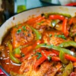 close up of the Mexican Braised Chicken dish in an lodge cast iron enameled dutch oven.