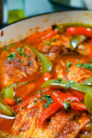 close up of the Mexican Braised Chicken dish in an lodge cast iron enameled dutch oven.