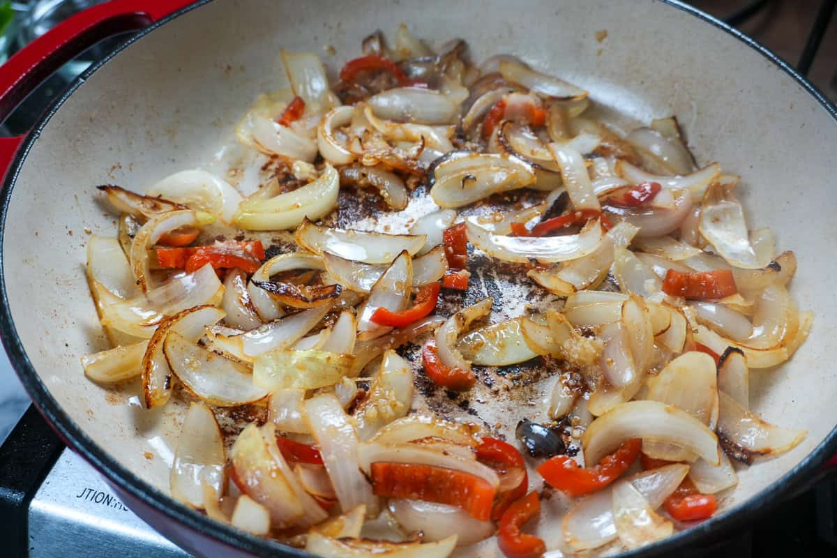browned onions and jalapenos in a dutch oven.