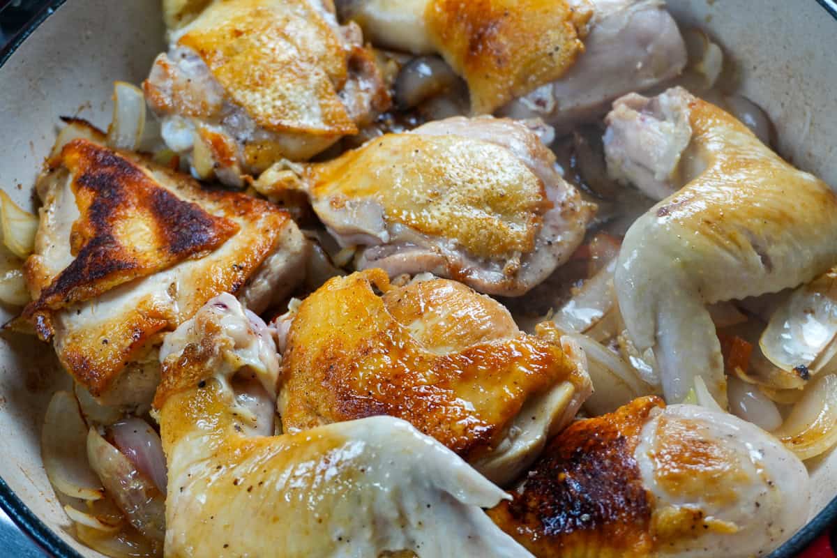 seared chicken on top of browned onion mixture.