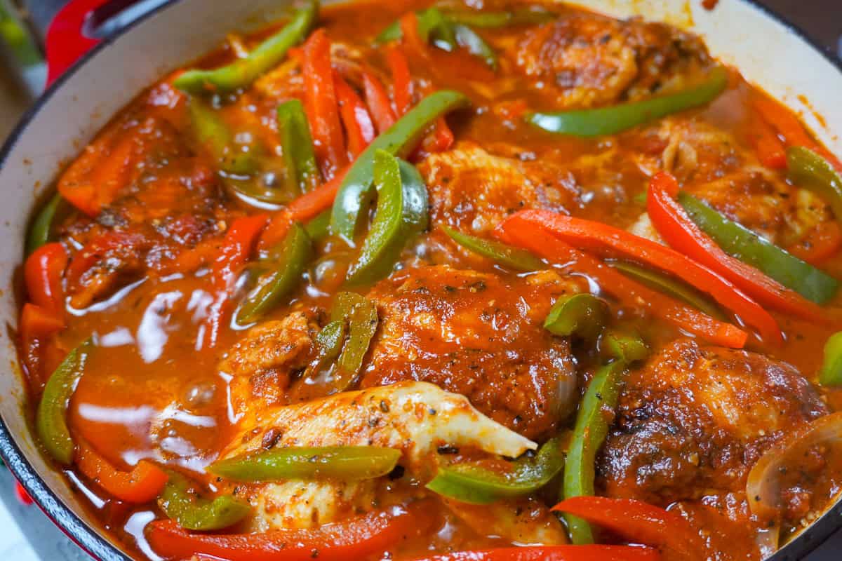 close up of braised chicken in dutch oven.