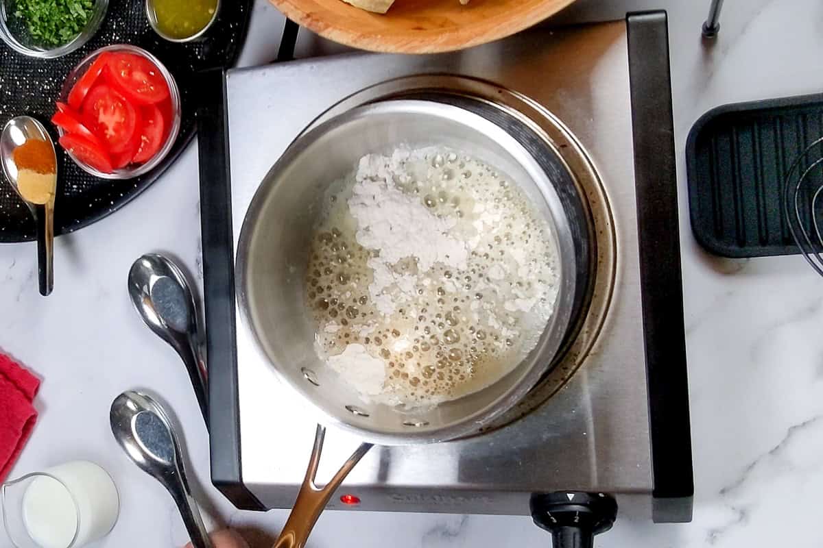 flour added to butter to make a roux for the nacho cheese sauce.