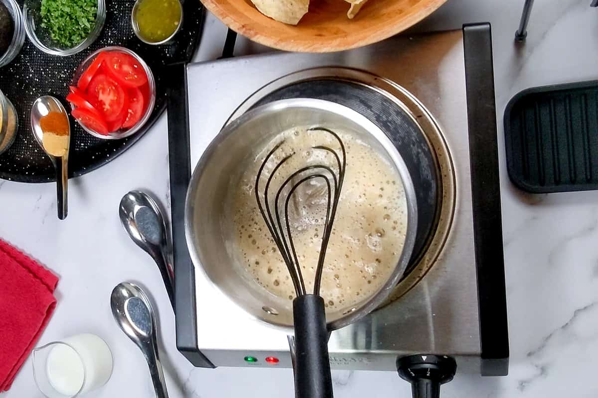 roux forming in sauce pan.