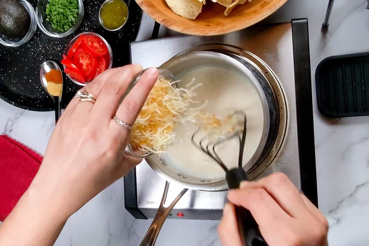shredded cheese added to the thicken milk.