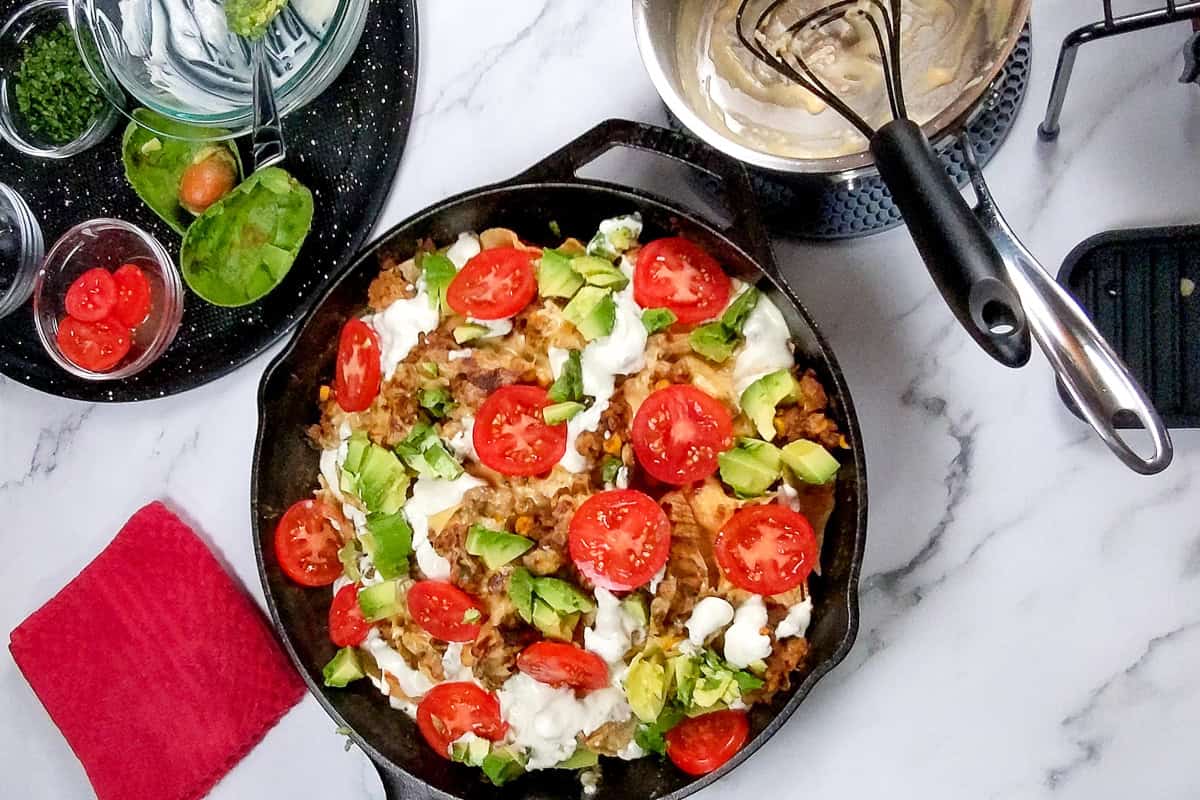 sliced campari tomatoes, and diced avocados topped the nachos.