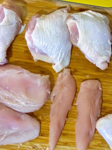 showcasing all of the chicken parts on the cutting board.