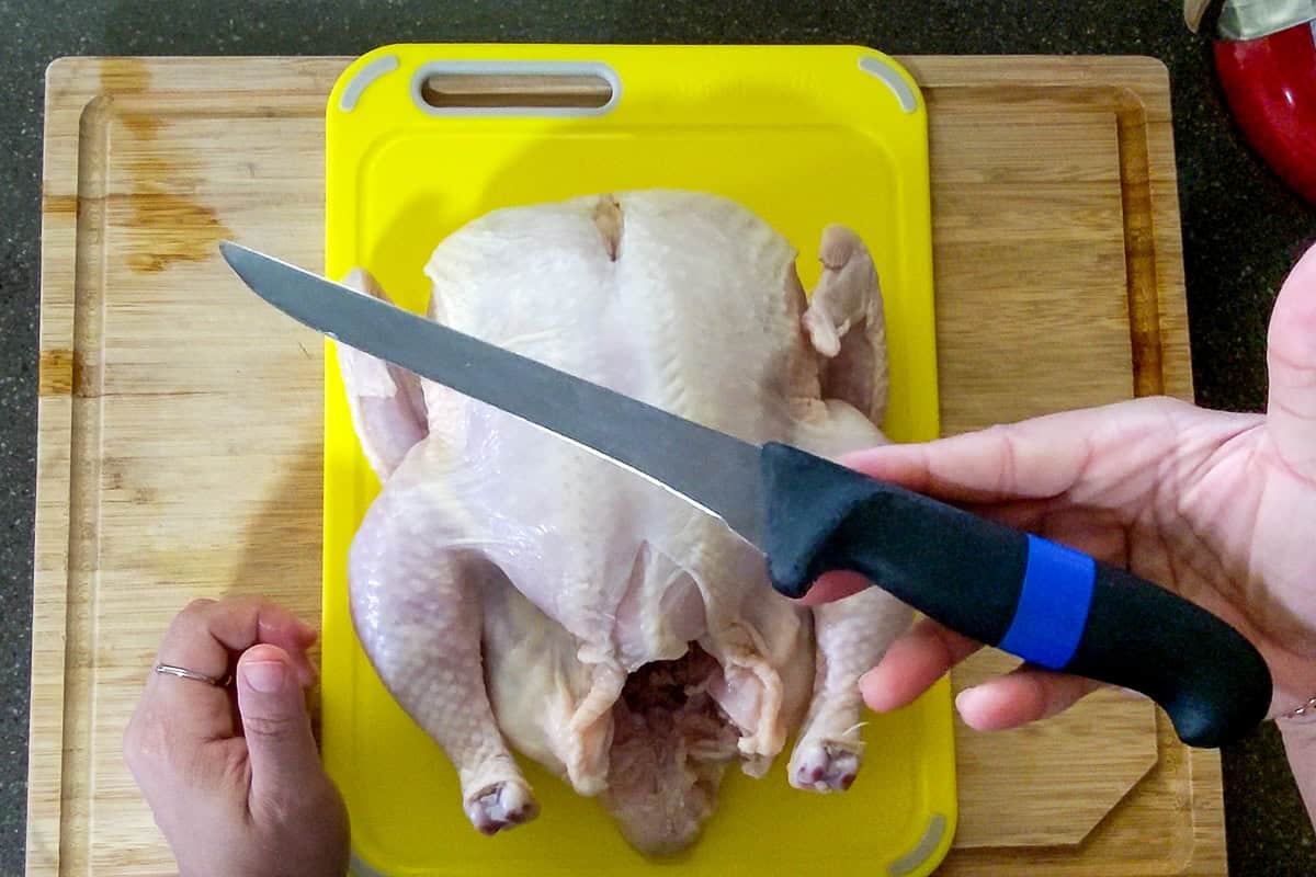 upclose view of the boning knife that has a long thin blade with a pointy tip.