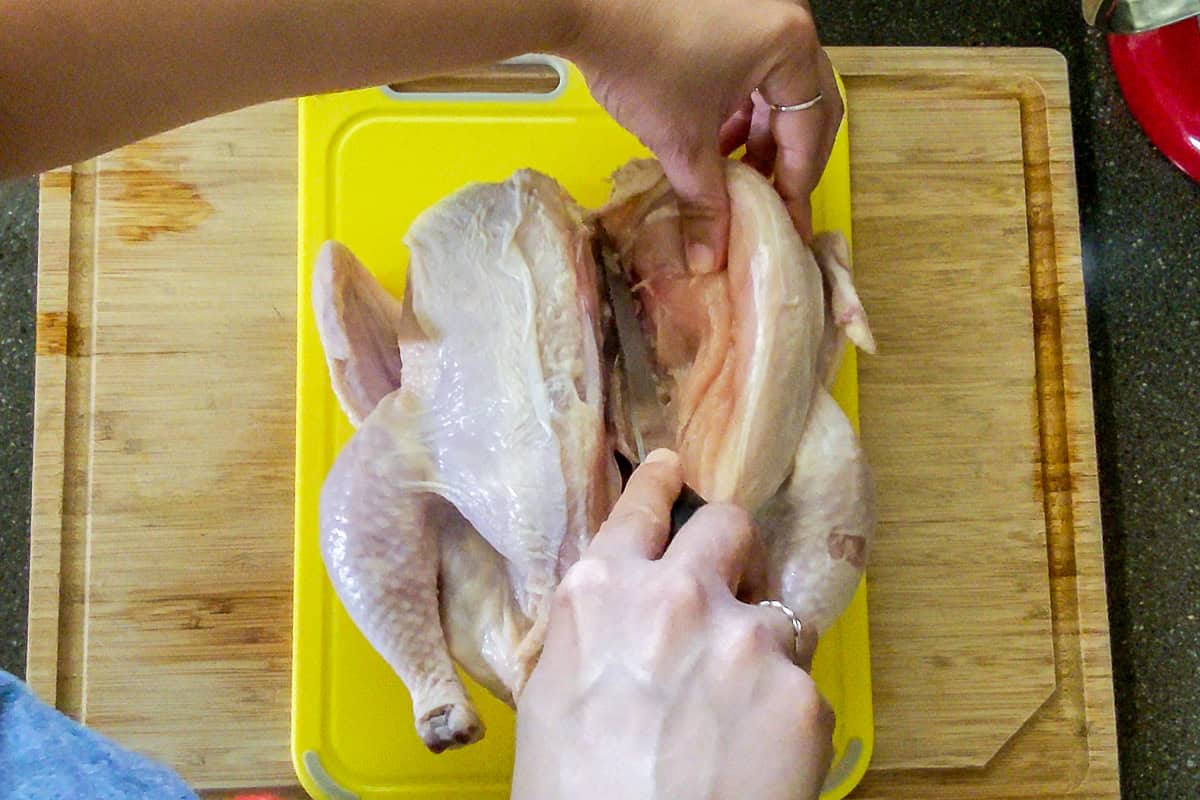 almost completely removing the chicken breast from the breast bone.
