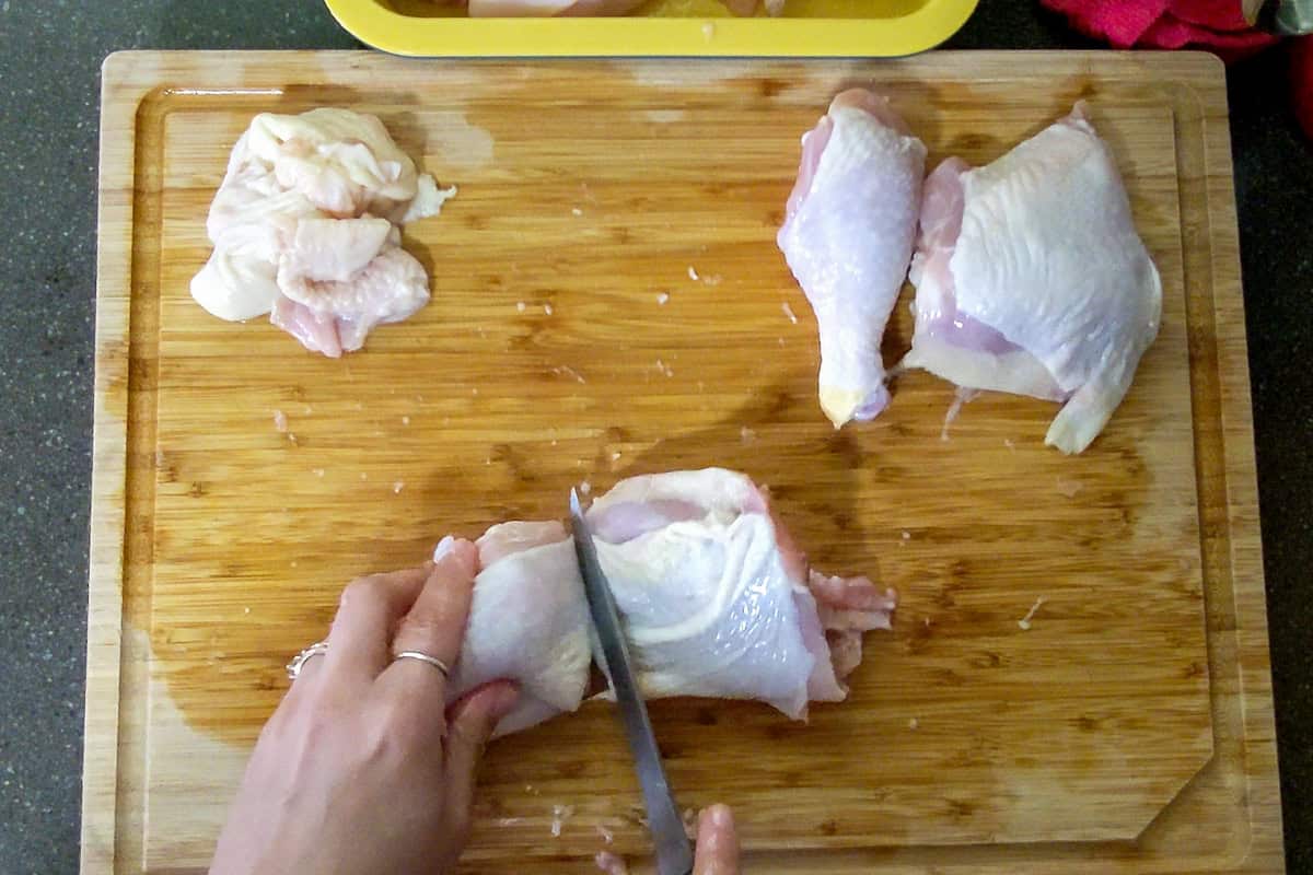 turning the chicken over to make a clean cut skin side up.
