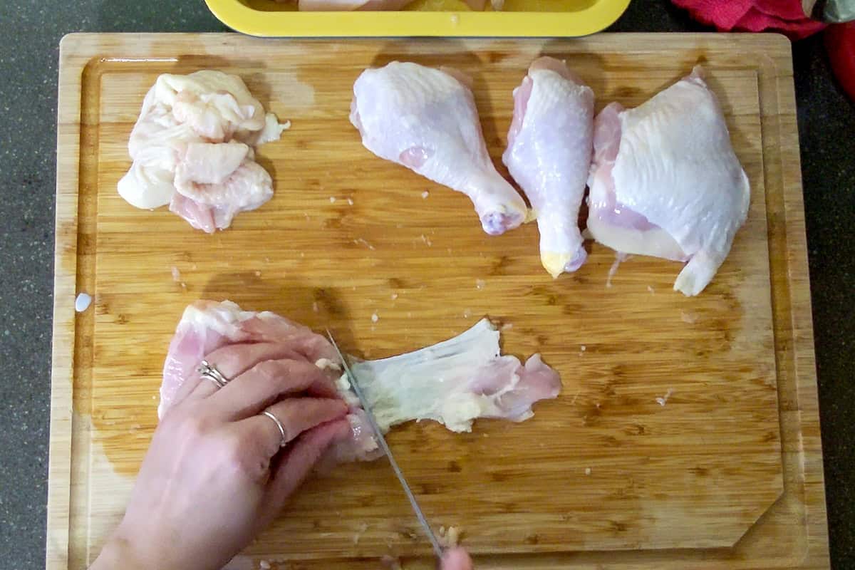 removing excess skin with the knife.