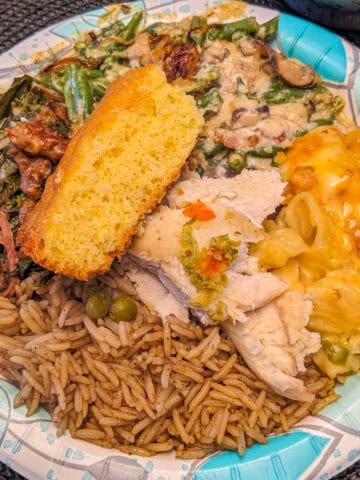 Haitian American Thanksgiving plate with diri djon djon, cornbread, collard greens, haitian mac and cheese and green bean casserole.