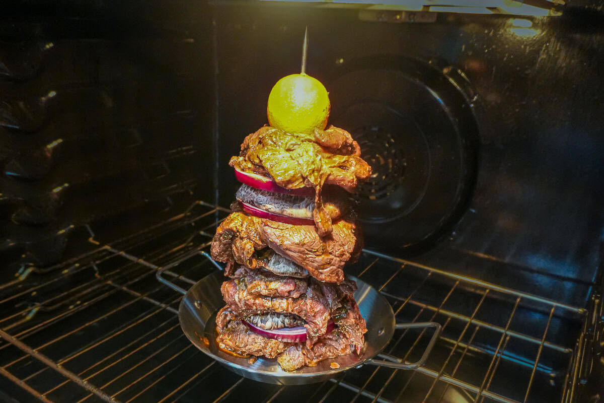 stacked beef shawarma in the oven.