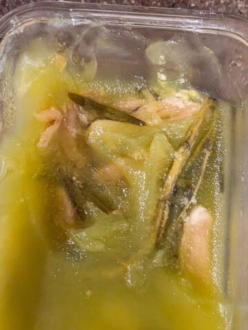 solidified garlic confit in a glass container.