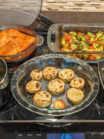 5 prepared dishes on a stove.