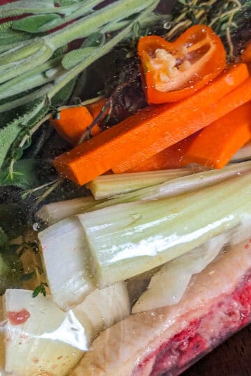 Mirepoix-Based Backbone Turkey Gravy with Haitian Spices in a resealable bag.