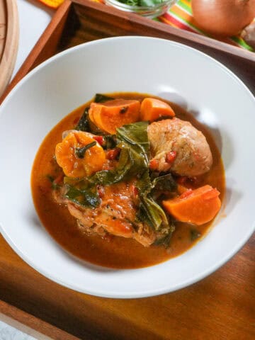 top view of the West African Peanut Stew with Chicken and Collard Greens in a wide rim bowl.