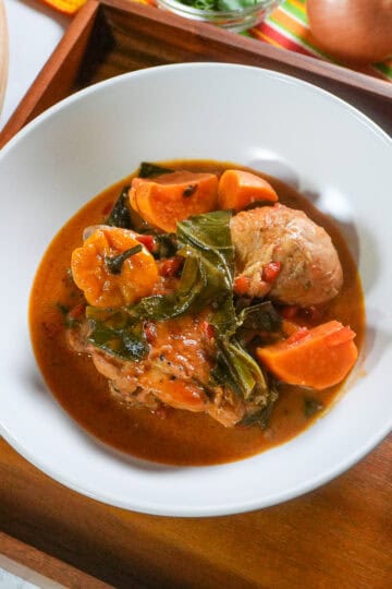 top view of the West African Peanut Stew with Chicken and Collard Greens in a wide rim bowl.