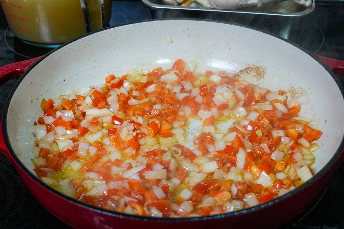 aromatics in an enameled dutch oven with oil.