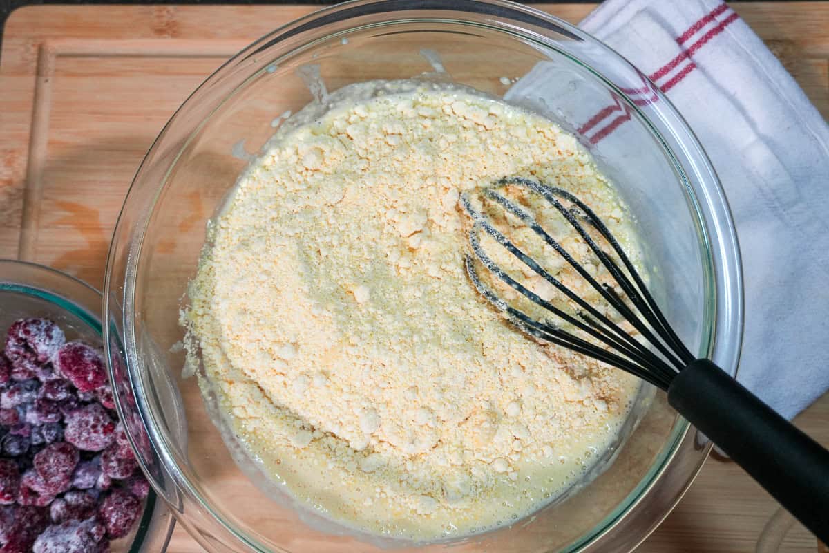 mixing bowl with wet ingredients and jiffy corn muffin mix.