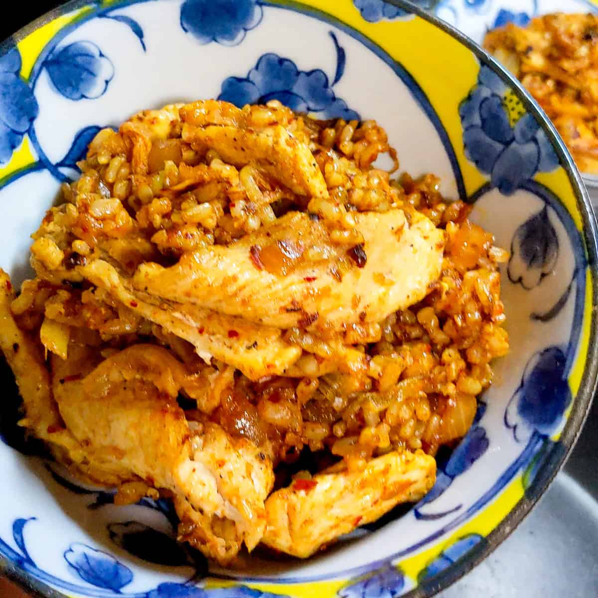 up close view of kitchen rice with chicken.