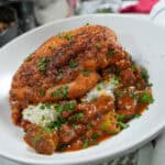 close up plate up of the Pan-Roasted Chicken and Andouille Sausage Gumbo in a wide rim bowl.