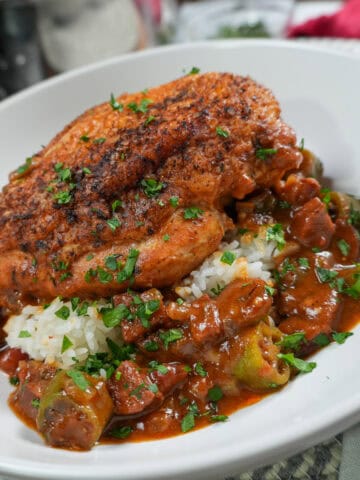close up plate up of the Pan-Roasted Chicken and Andouille Sausage Gumbo in a wide rim bowl.