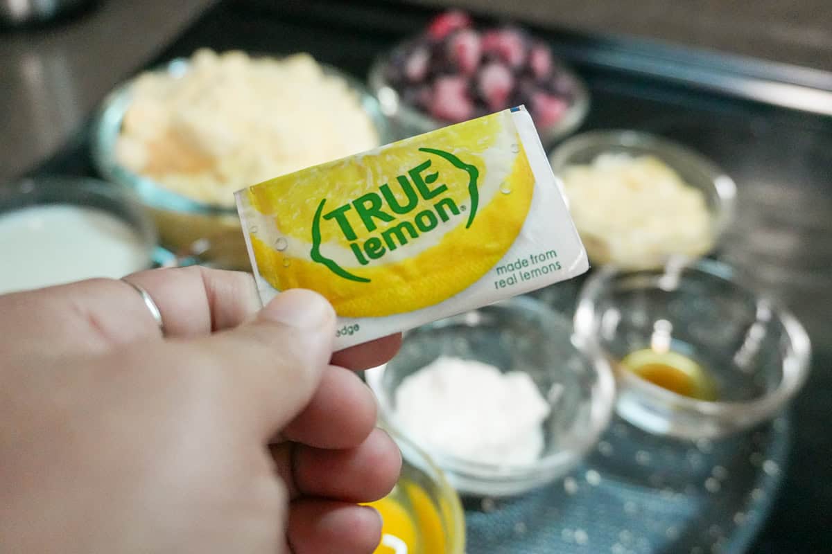 a packet of True Lemon's lemon granules held in hand.