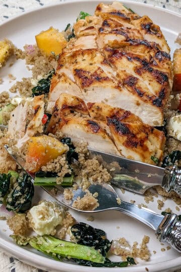Grilled Chicken with Peach Fonio and greens salad with peach piri piri dressing.