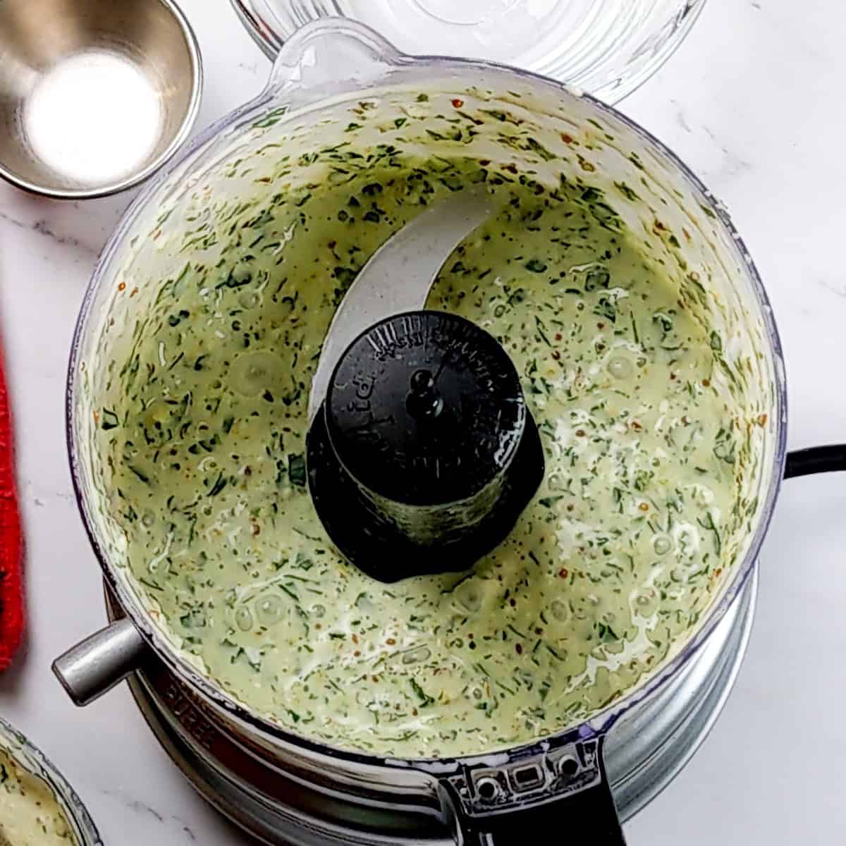 the finished product of the Lemon Dijon Mustard Remoulade in a food chopper.