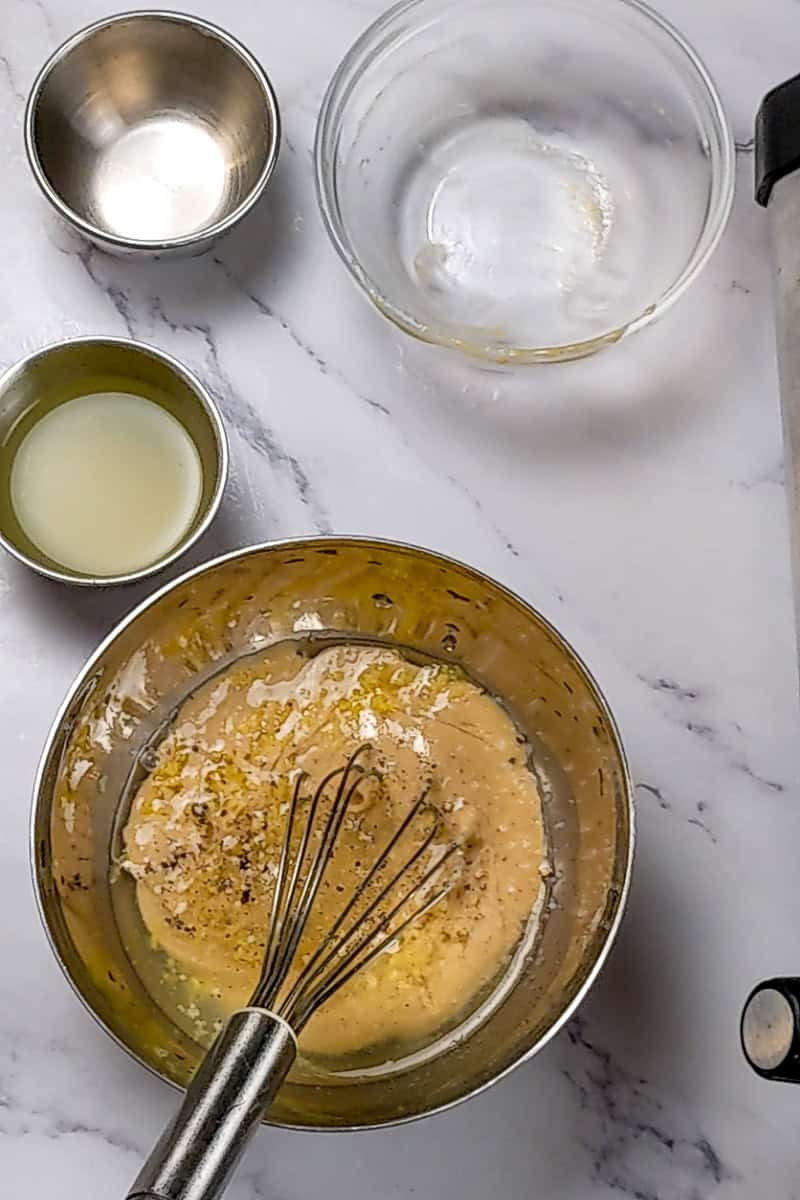 making the tahini paste, in the bowl is the tahini paste before adding other ingredients.