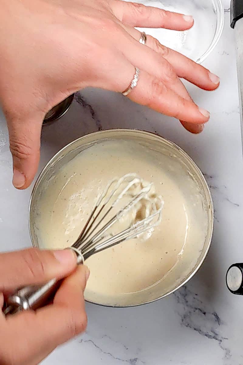 the finished tahini dressing being mixed.