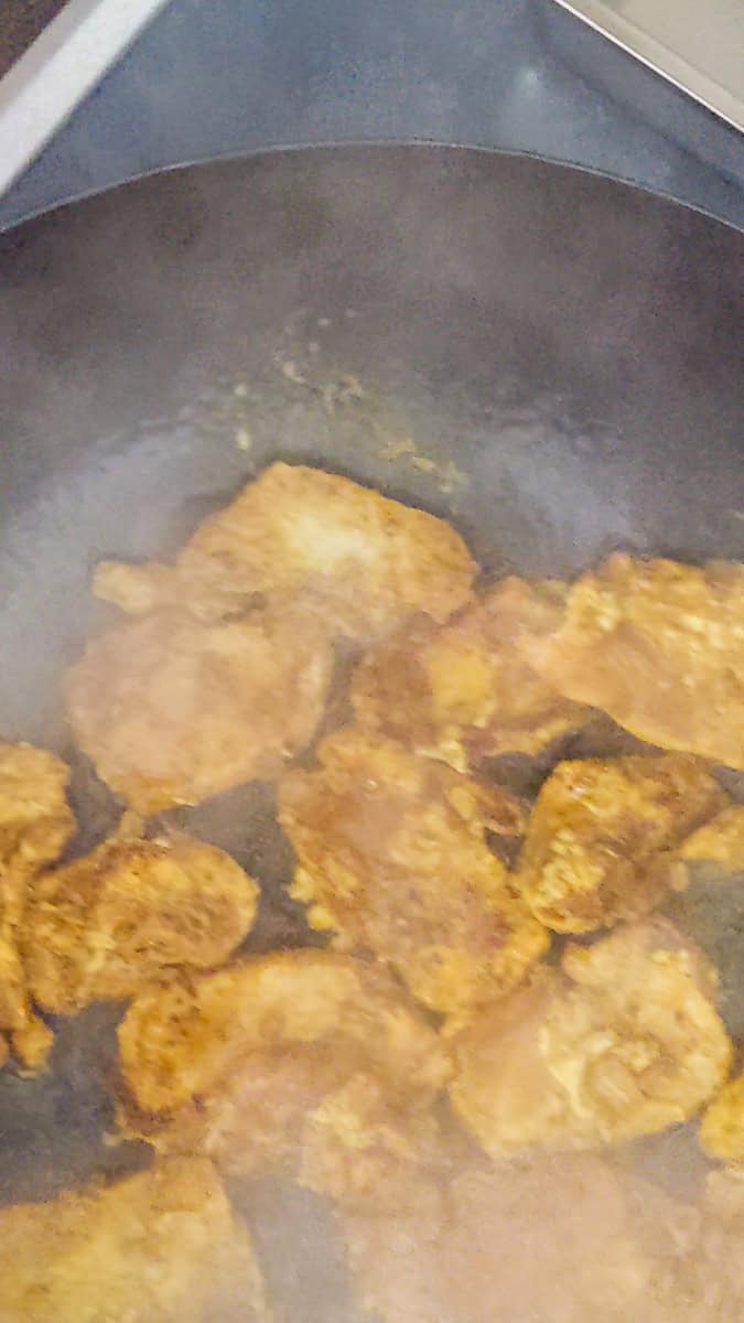 close up of the sliced brown chicken for the jamaican curry chicken stir fry.