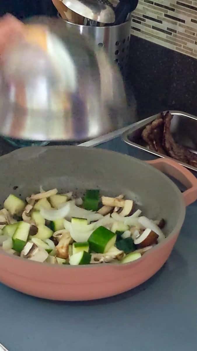 a bowl of prep vegetables pour into a saute pan for the hibachi style vegetables recipes.