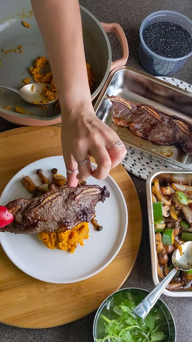 plating up the Trader Joe's Korean Short Ribs Recipe with Sweet Potatoes..