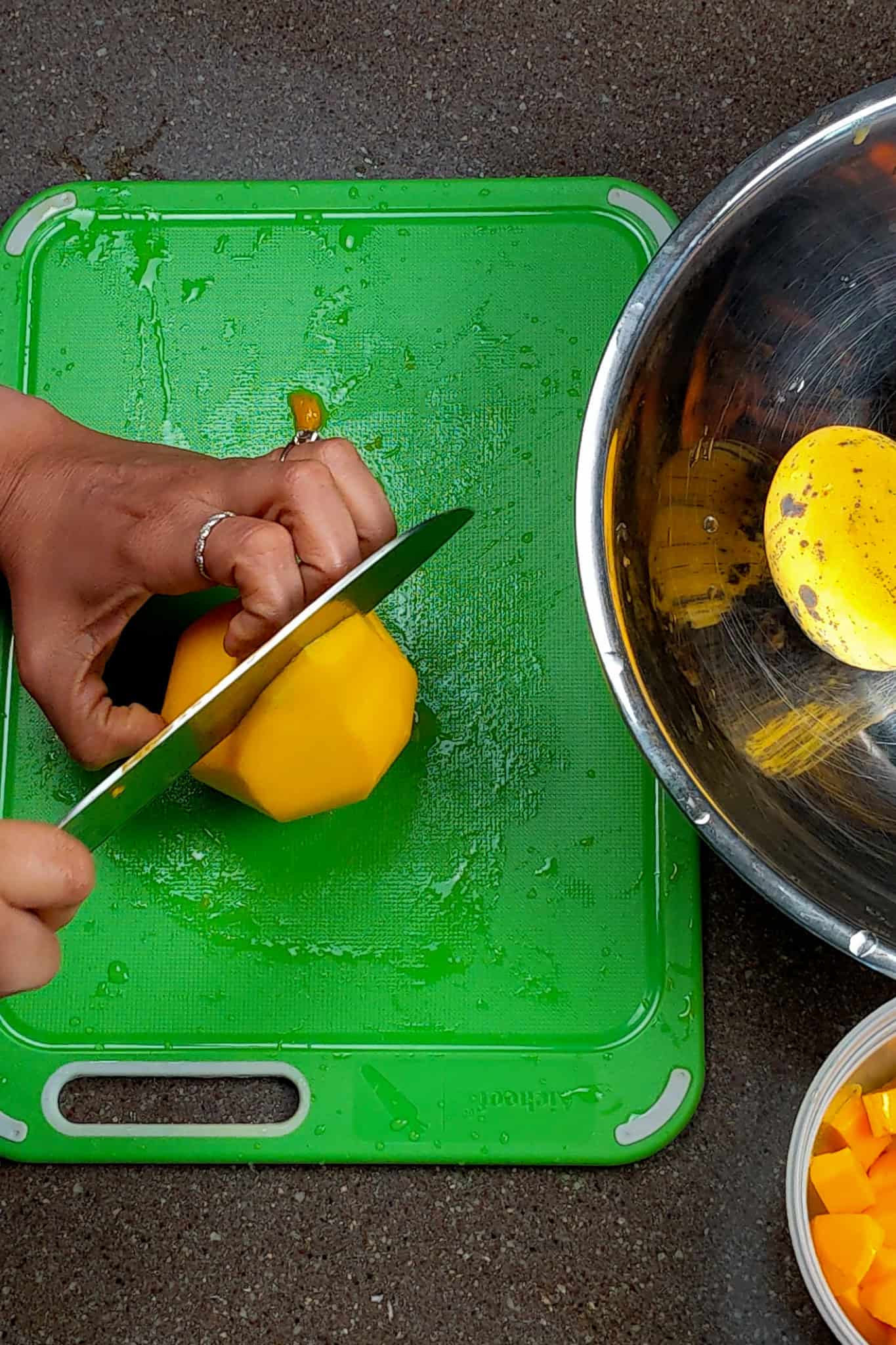 Cuting Off the First Mango Cheek.